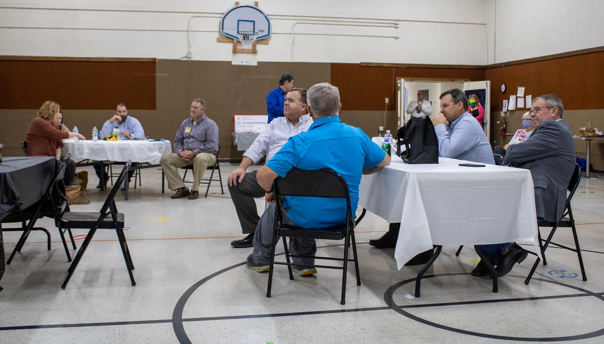 Guests sitting at tables during BAH presentation
